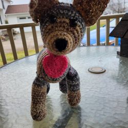 Hand crocheted brown and tan dog with heart collar.