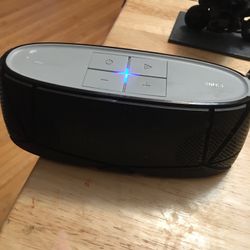 oval grey and black bluetooth speaker
