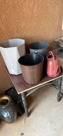 Brand New plastic containers and watering . Total of 4 items