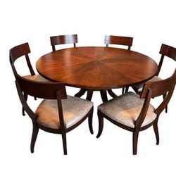 Ethan Allen round dining room table and 8 brown leather chair set.
