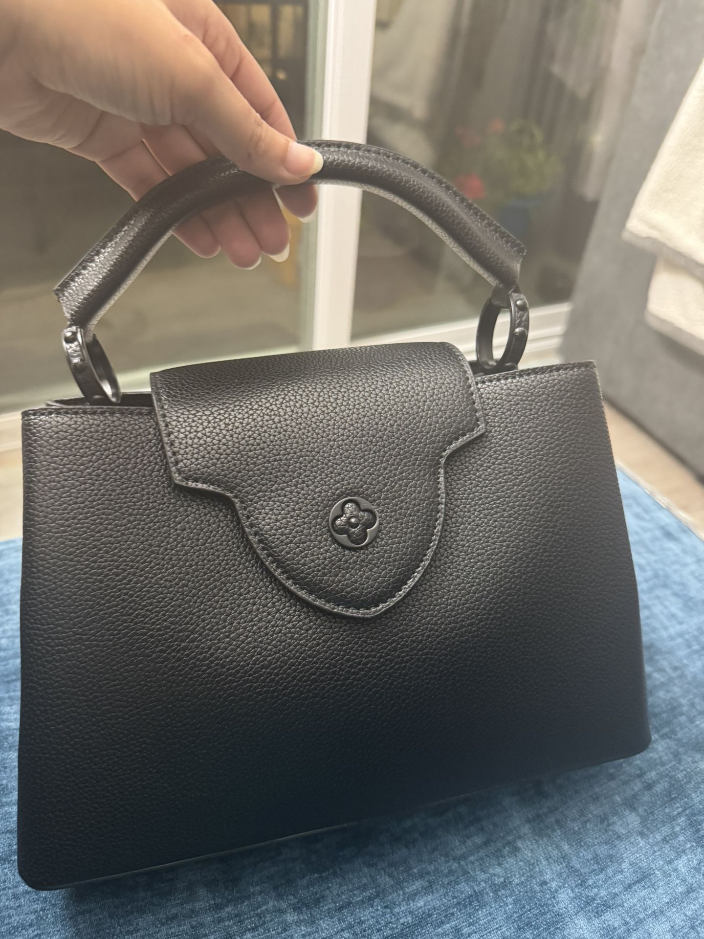Louis Vuiton Black Advantage Bag.