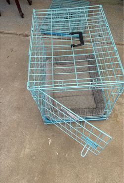 2- Dog cage with little bed size 24”long 17.5” wide 19.5” tall $25 each