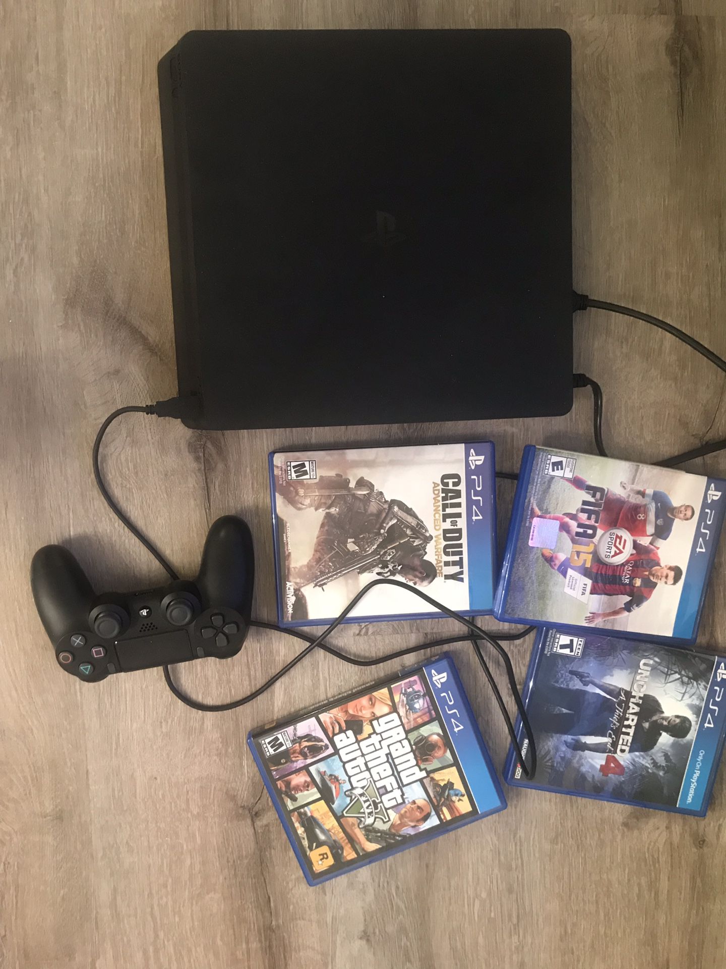 PS4 with Controller and 4 games