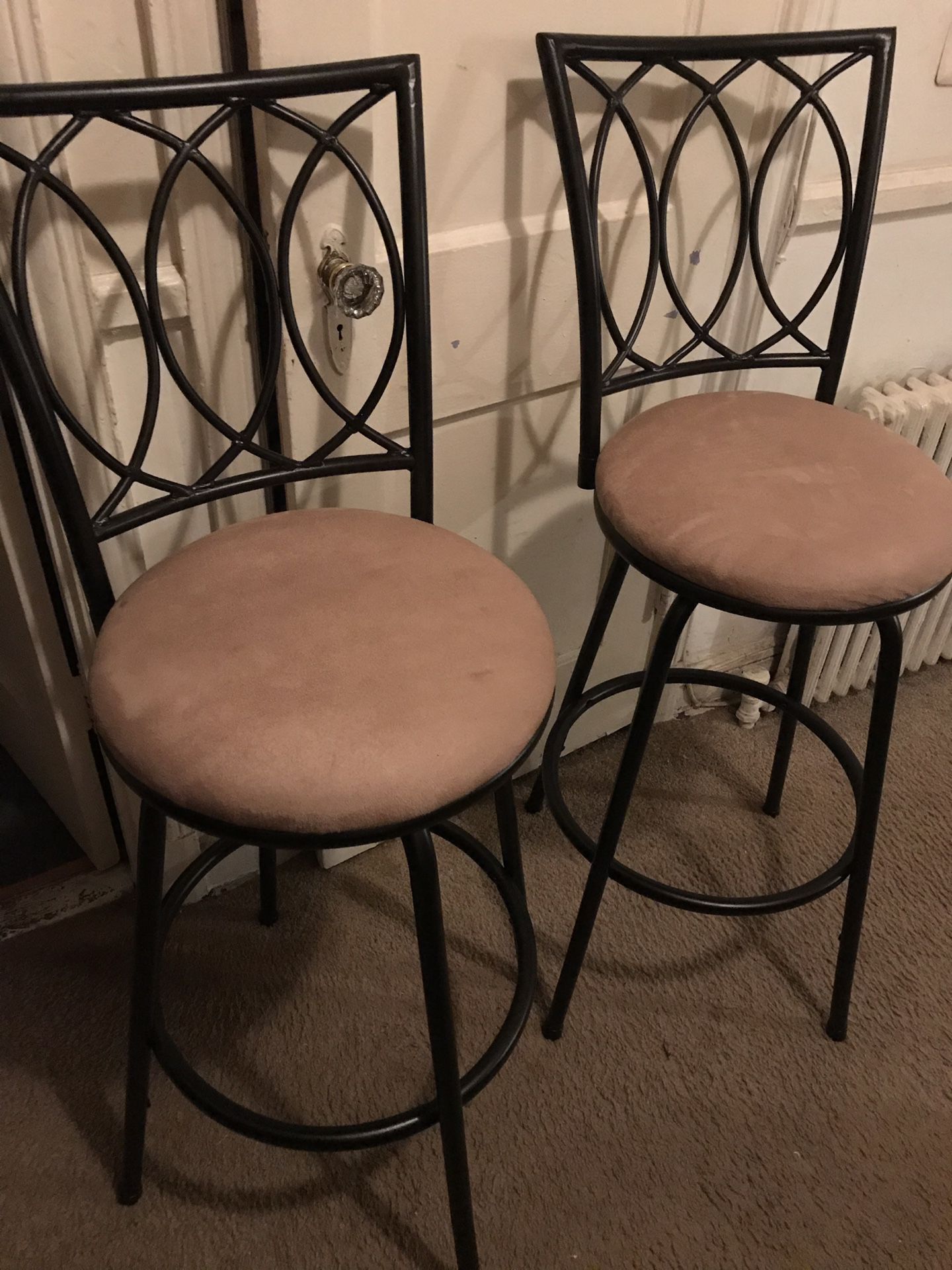 Set of two barstools black metal with tan seats, Very very clean 43 inches tall and 29 inches from floor to seat also the seats turn left to right