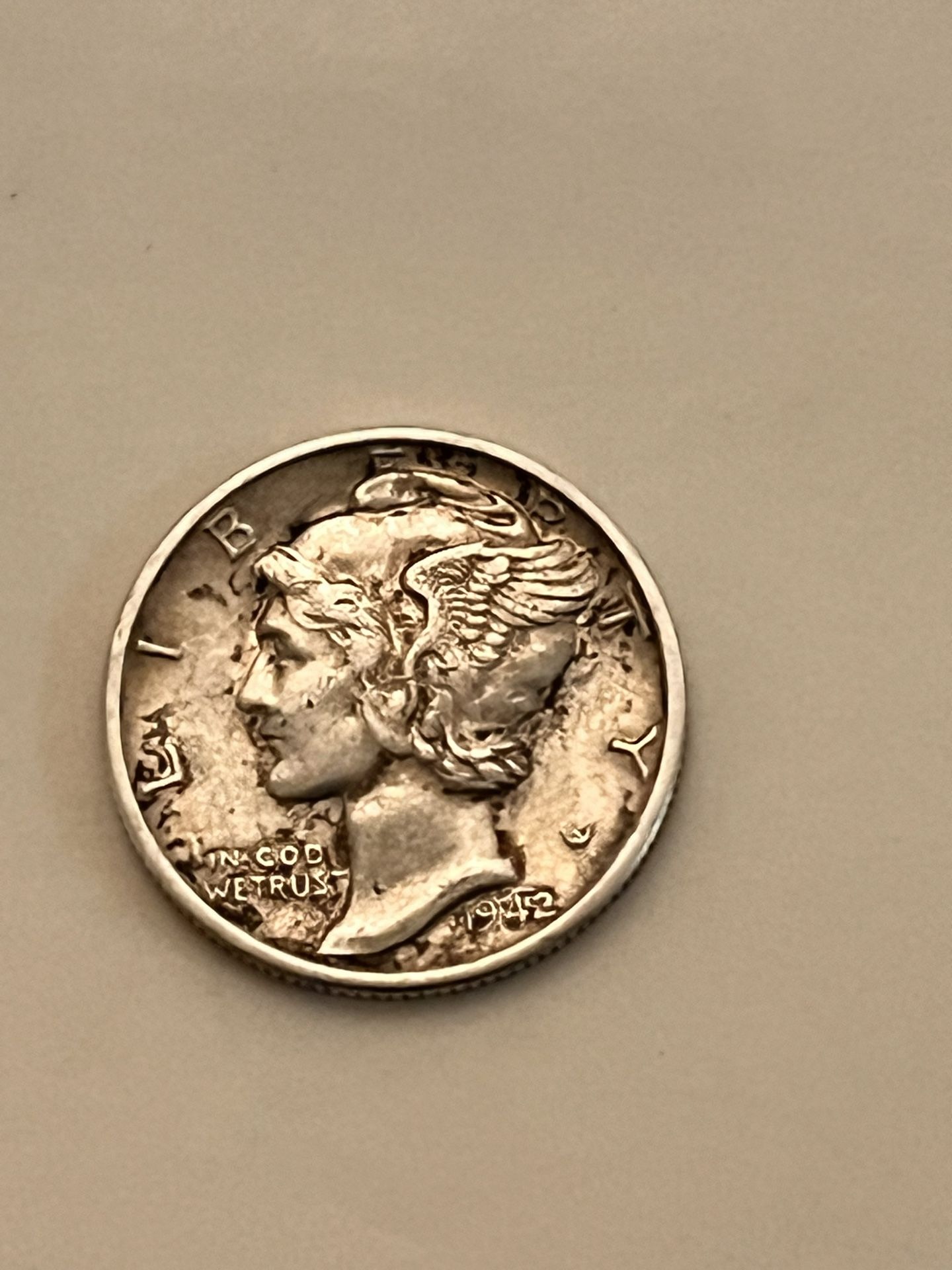 1042s Merc. Dime