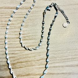 Elegant silver twisted chain necklace in silver. This silver necklace features a delicate spiral design for subtle shine. Perfect for everyday wear or