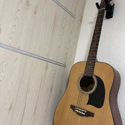 Washburn Lyon series acoustic guitar (often called “George Washburn Lyon”).