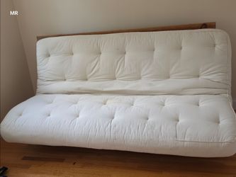 Wooden futton with white mattress