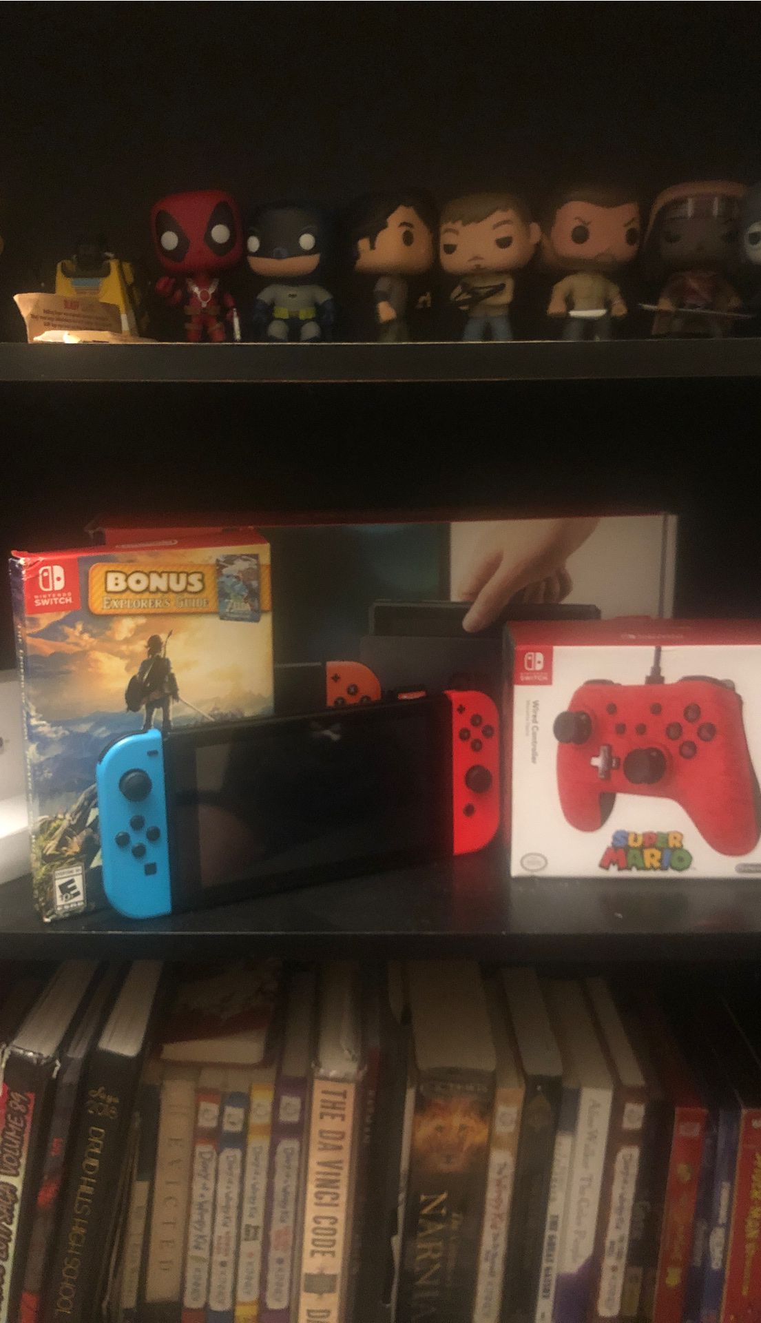 Nintendo switch to that includes everything in the box plus a controller with legend of Zelda breath of the wild game cart with super smash bro’s ult