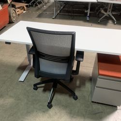 Complete Home Office That Included Electric Sit To Stand 30 X 70”,  Height Range 27” To 47”, Mobile Storage Pedestal With Cushion, And OFS Ergo Chair