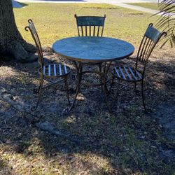 Out Door Wrought Iron Table And Three Chairs With Tile