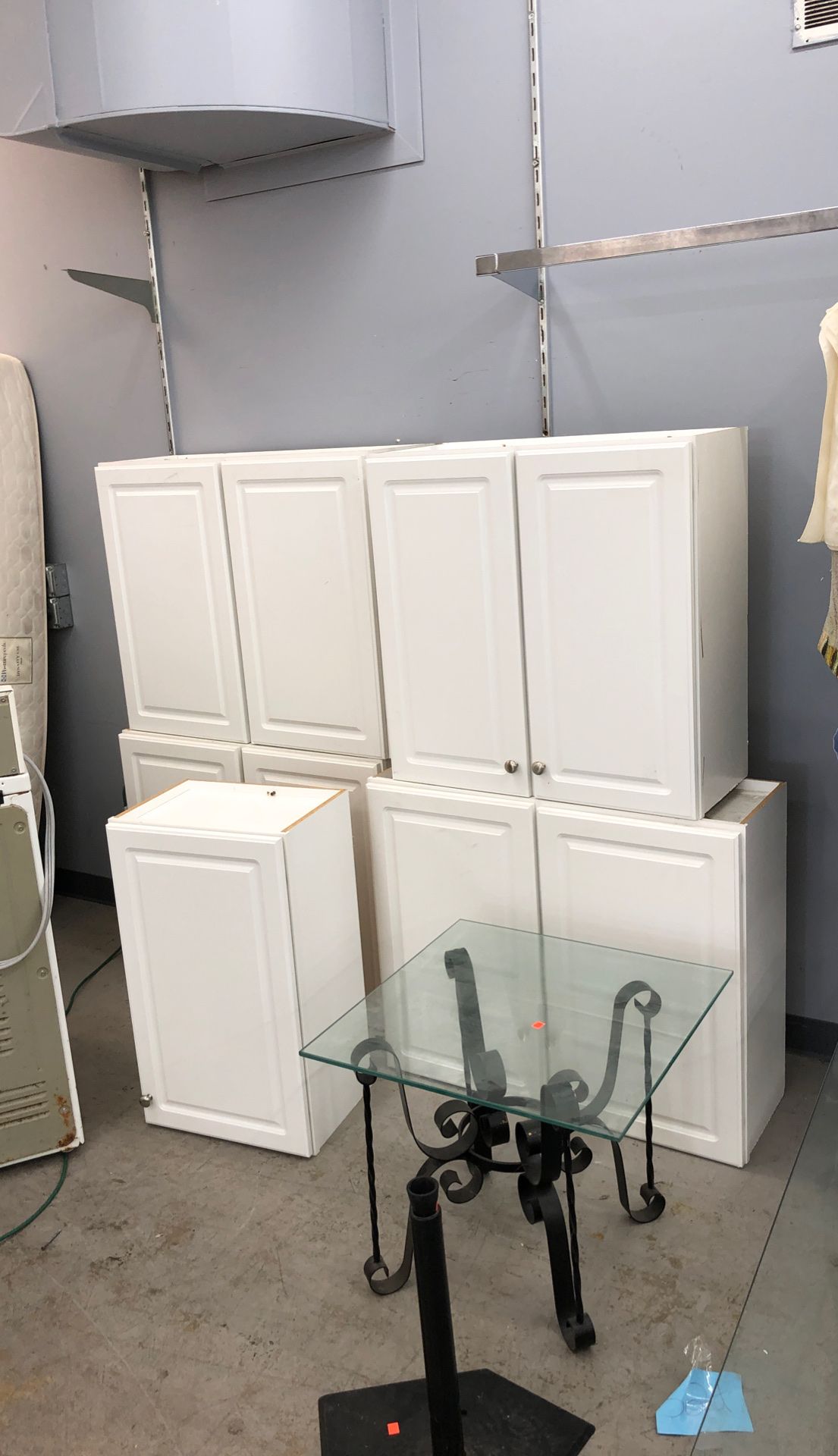 Five white upper cabinets