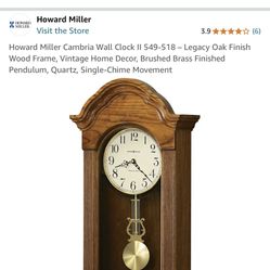 MOUTED WOOD WALL CLOCK THAT IS A REPLICA OF A CLASSICAL ANTIQUE CLOCK! 