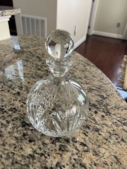 Elegant crystal decanter with stopper.
