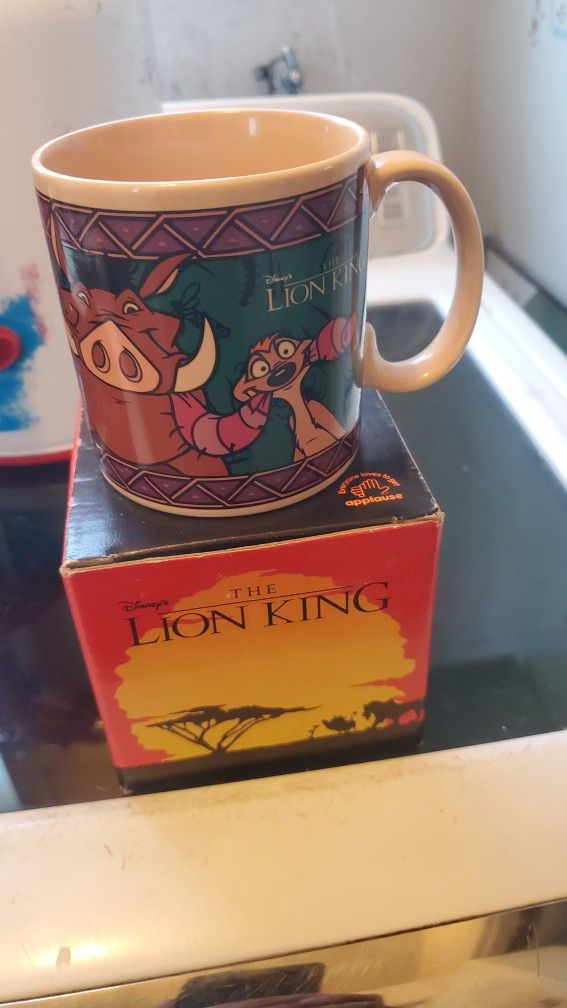 vintage Disney's The Lion King ceramic coffee mug featuring Timon and Pumbaa, known for
