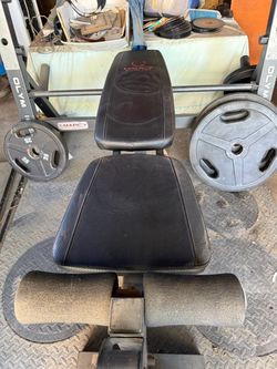 Marcy adjustable workout bench with leg curl and leg extension