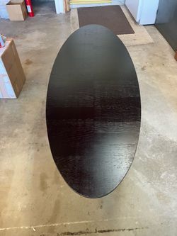 Black oval wooden coffee table