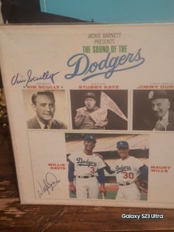 Dodger album signed by vin scully  and Willie davies