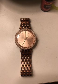 Woman’s rose gold Michael kors watch