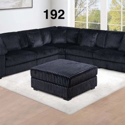 LARGE BLACK FUR LIKE CORDUROY SECTIONAL WITH OTTOMAN