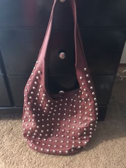 Red studded purse