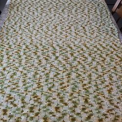 Very very large vintage crochet table topper. Also can be used on coffee table . Shades of green and brown. Picture is taken on a very large table