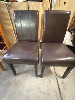 2 dark brown dining chairs