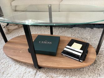 Glass top coffee table with wood shelf