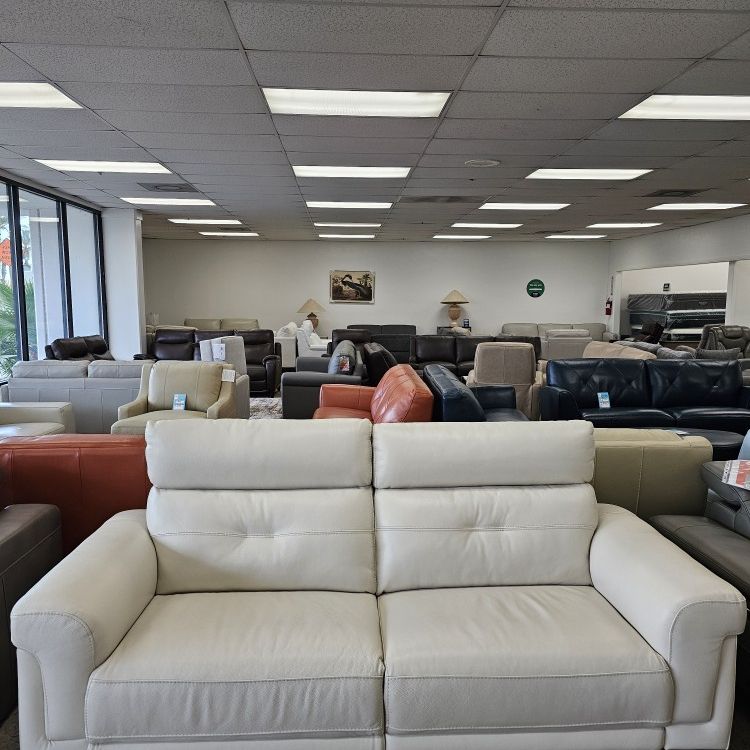 Leather loveseat with dual power recliners 