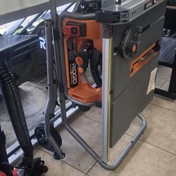 NEW RIDGID 10" TABLESAW WITH ROLLING STAND 220$ RETAILS $550