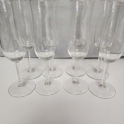 Set of 8 plain champagne glasses, no chips.  9"H x 2W x 5D