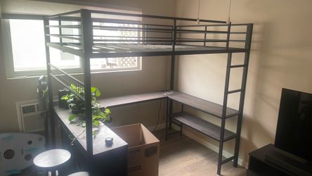 Elevated bed with desk under