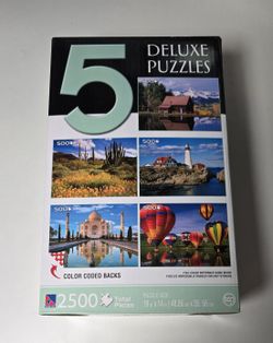 Puzzlers Collection box containing five deluxe jigsaw puzzles with photographic images. 