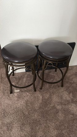 Two swivel bar stools