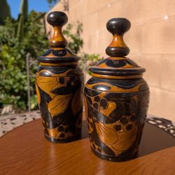 2 carved wooden jars with lids