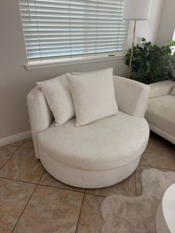 large white round fabric swivel chair