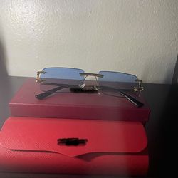 Blue Cartier gold frame sun glasses