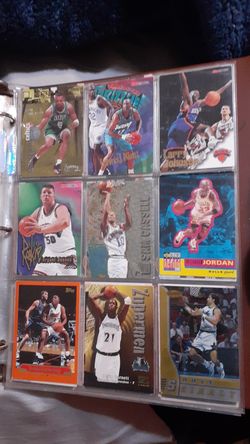 370 nba cards and 70 baseball cards in a album book