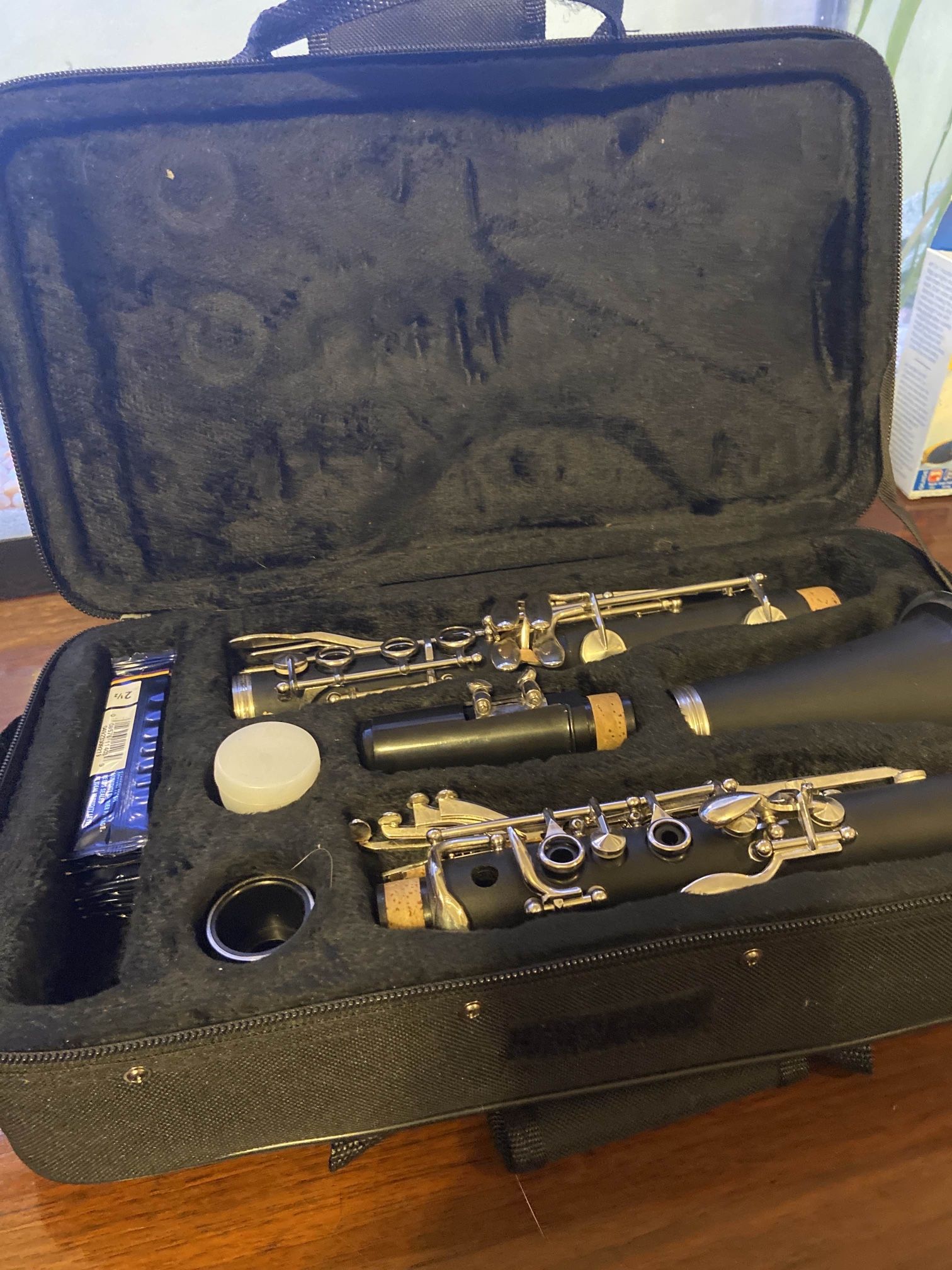 Clarinet With Case, Multiple Un-opened Reeds And Other Accessories.