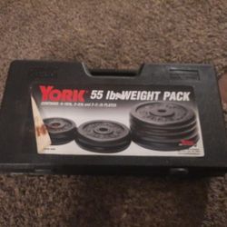 SET OF 8 YORK BARBELL WEIGHT PLATES 55 POUNDS Plus CARRY CASE