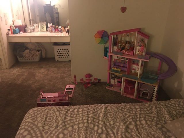 Barbie dream house and camper with barbies and accessories