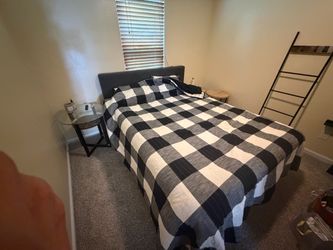 Queen size bed frame and mattress.