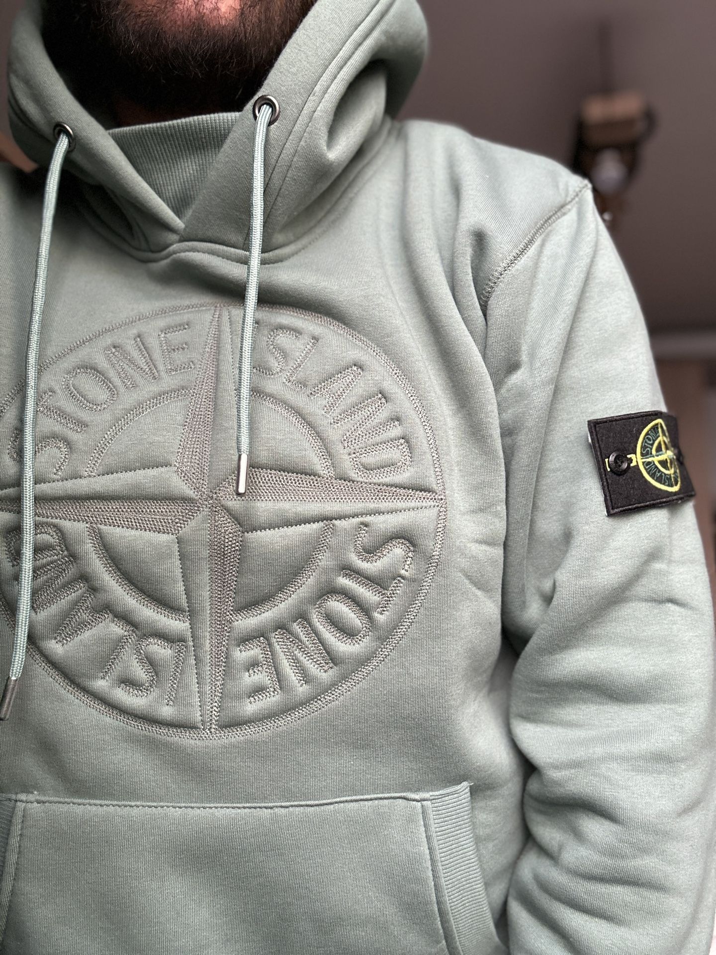 stone island hoodie logo on front
