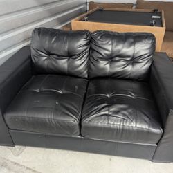 Small black couch/loveseat
The couch is about 59x35 
From the floor to the top of the seat is about 16 and 1/2 in 
From the floor to the top of the ba
