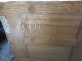 Heavy pine door frame is attached with hinges from home depot