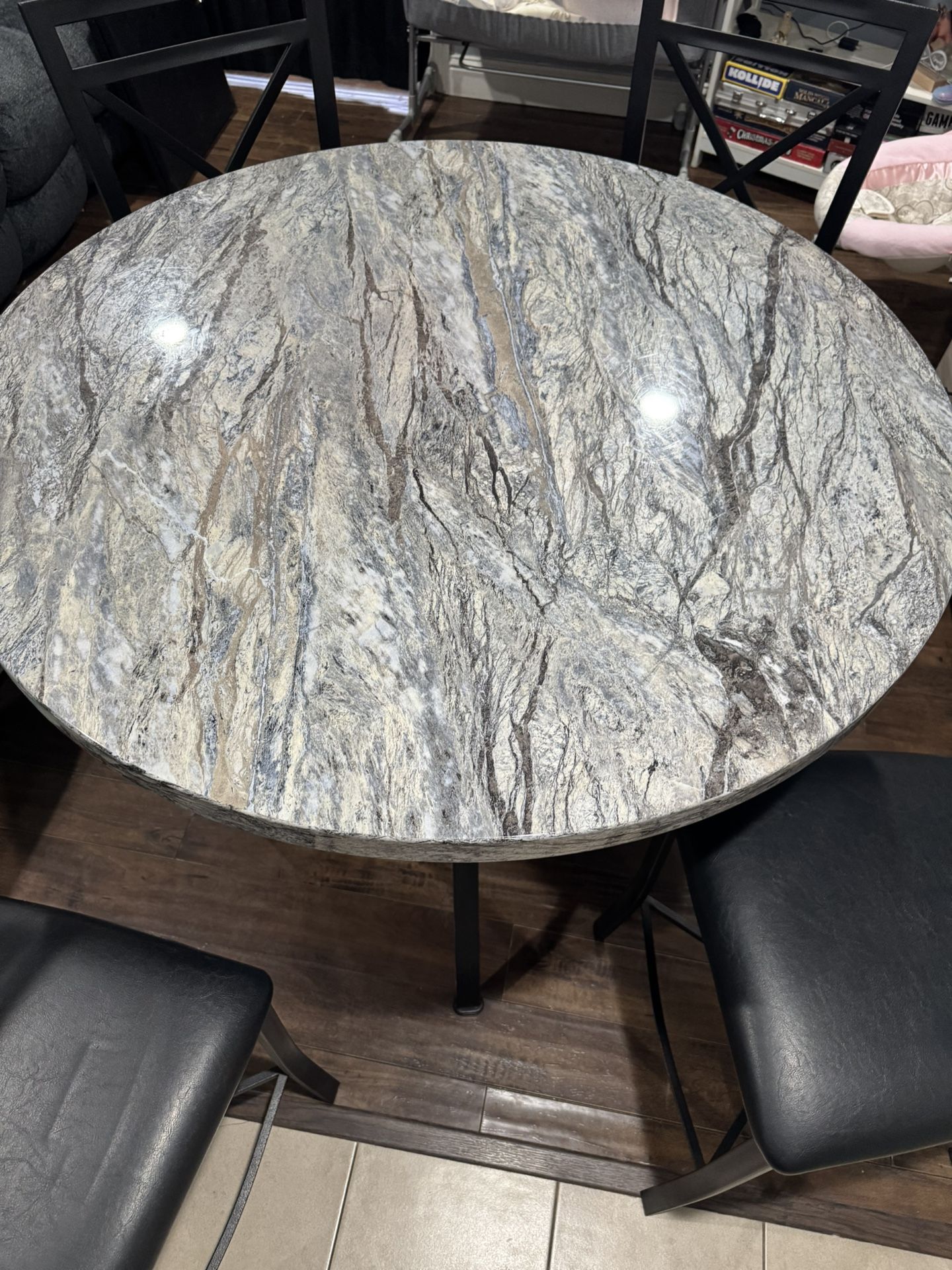 Round White And Black Marble Table With Four Chairs