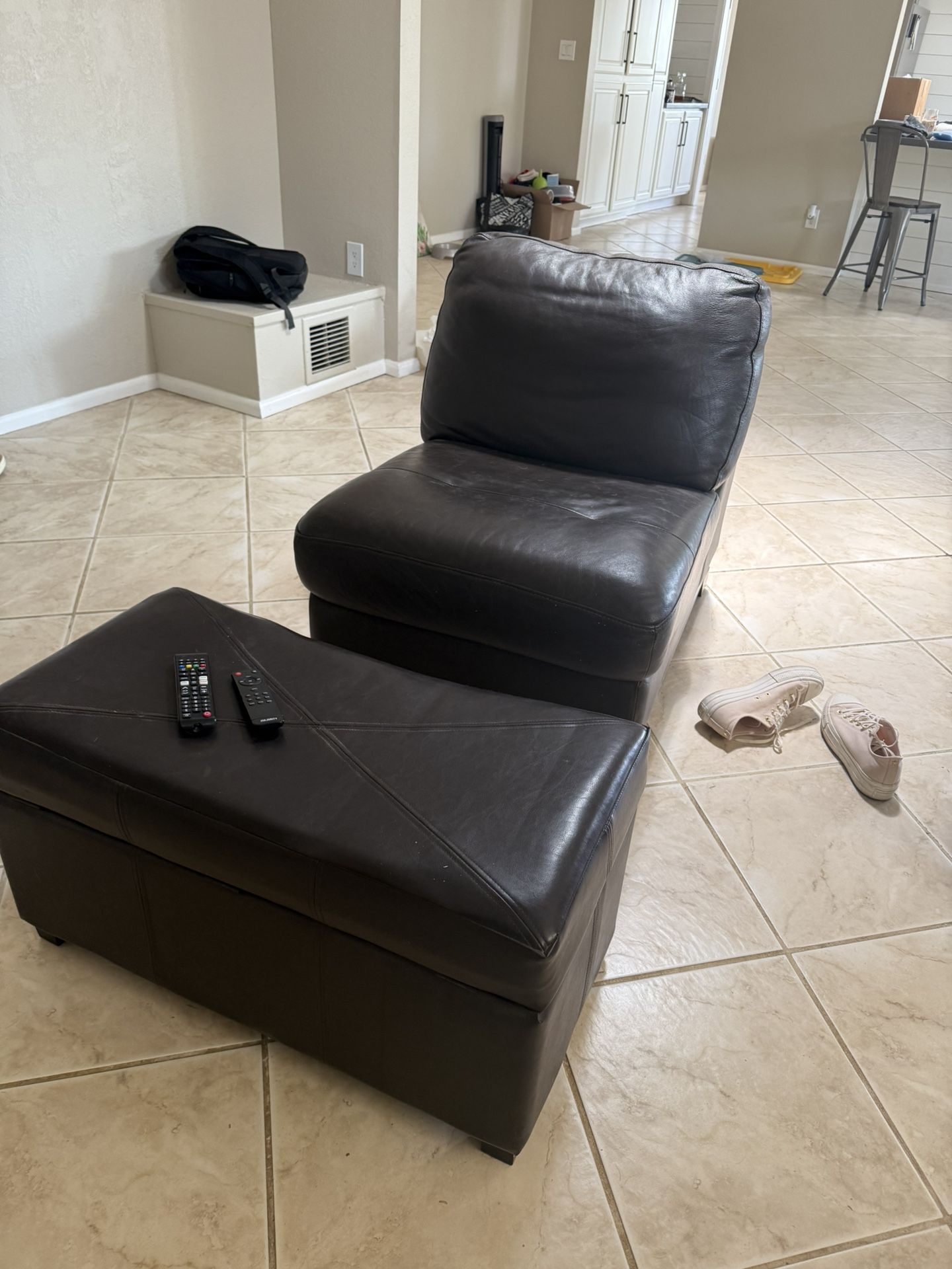 Comfortable brown, leather chair, and ottoman