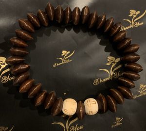 Photo Large stretch corded wood inspired bracelet with two center crosses
