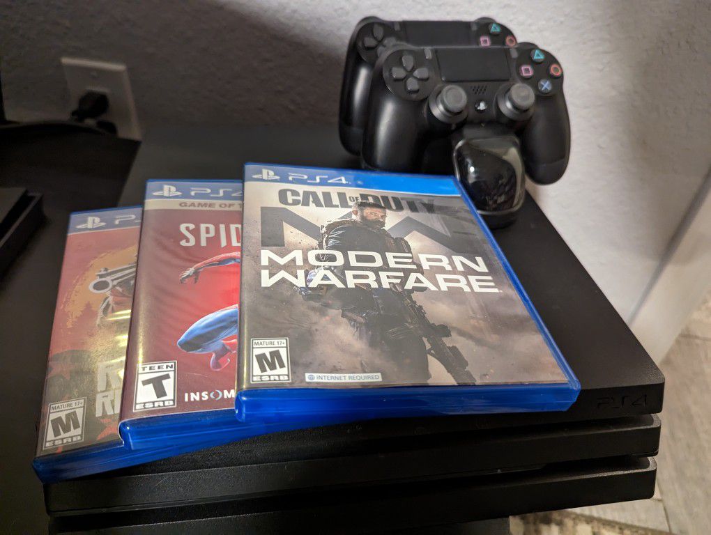 PS4 PRO w/ 2 Controllers And 3 Games