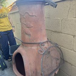 Word burning clay chiminea